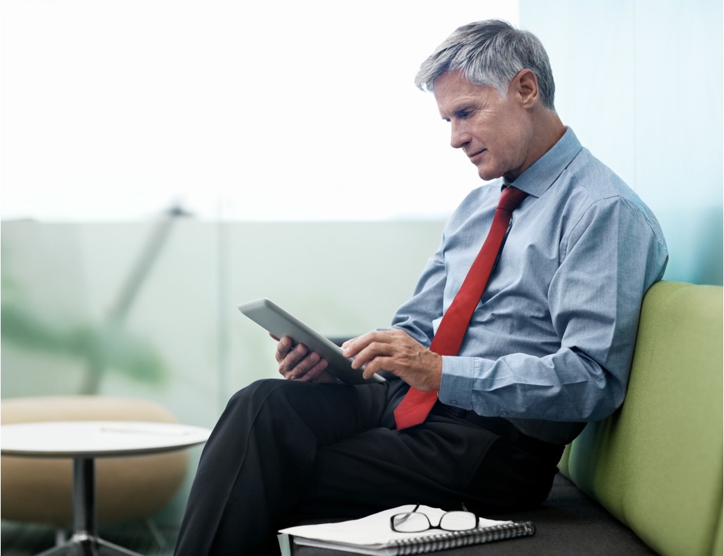 Man sitting on couch in a suit