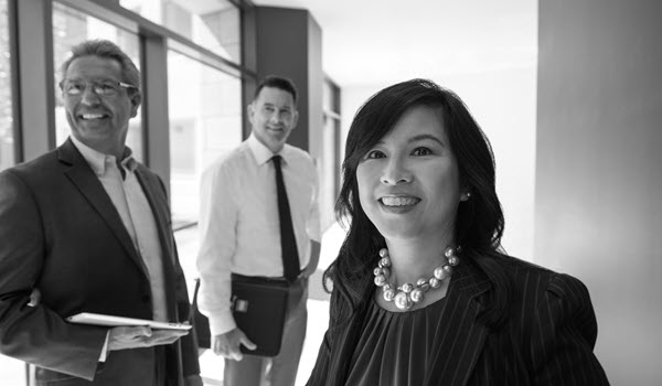 Three RIA employees of different ethnic background.