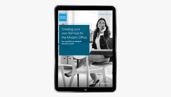A tablet shows the cover of the Modern Office white paper.