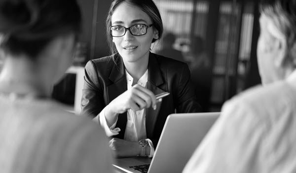 Advisor talks between two clients