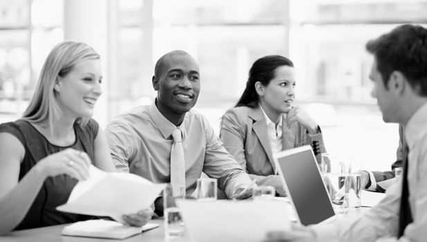 An intern takes part in a meeting at a firm.