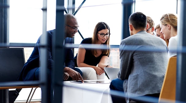 Advisors around a table having a conversation.