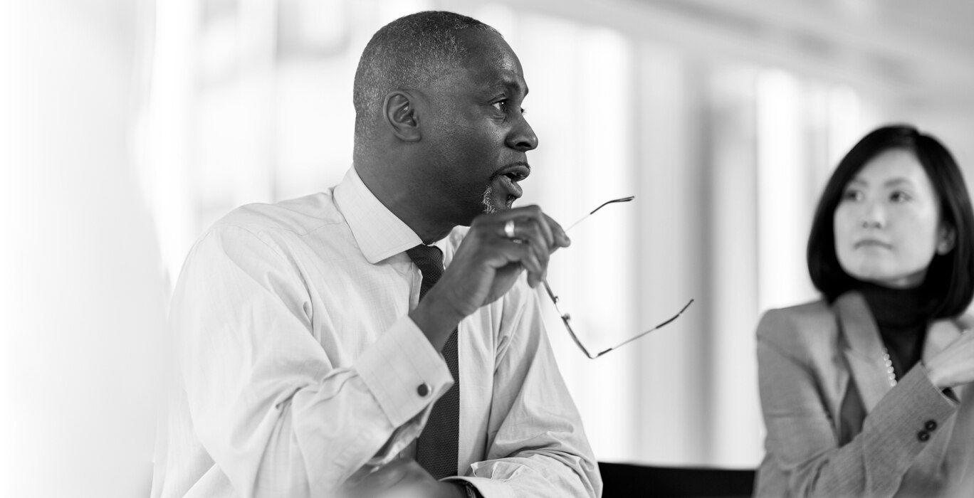 A man and woman talking in an office