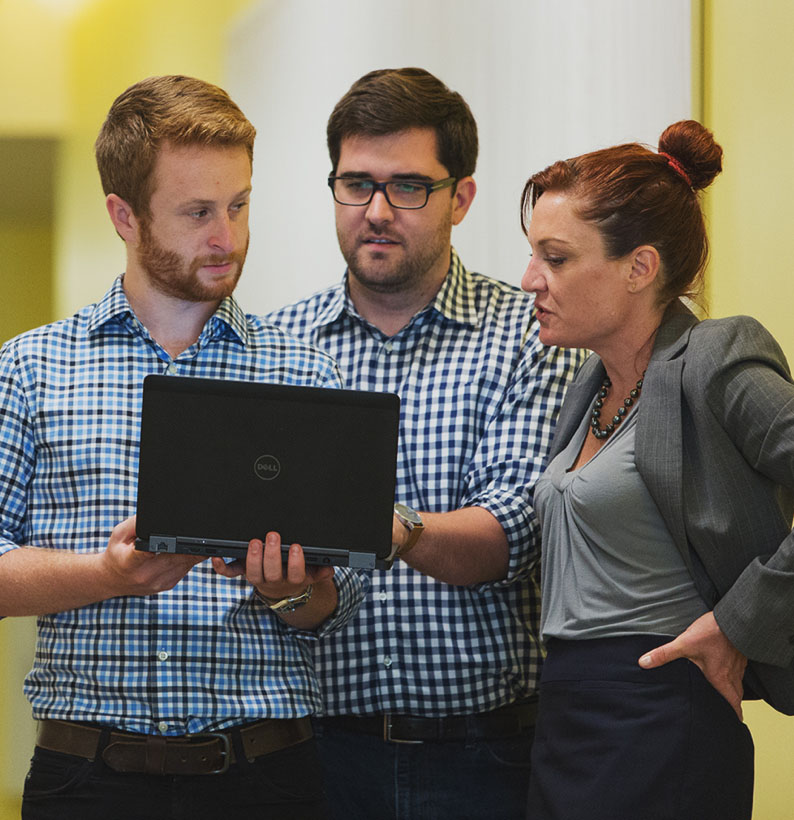 3 people meeting in a hall