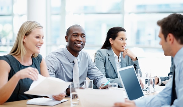 An intern takes part in a meeting at a firm.