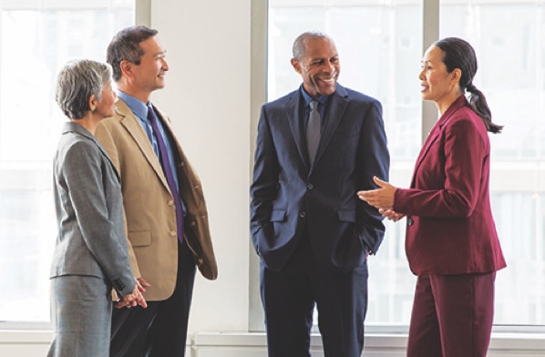 A diverse team discusses talent recruitment and retention.